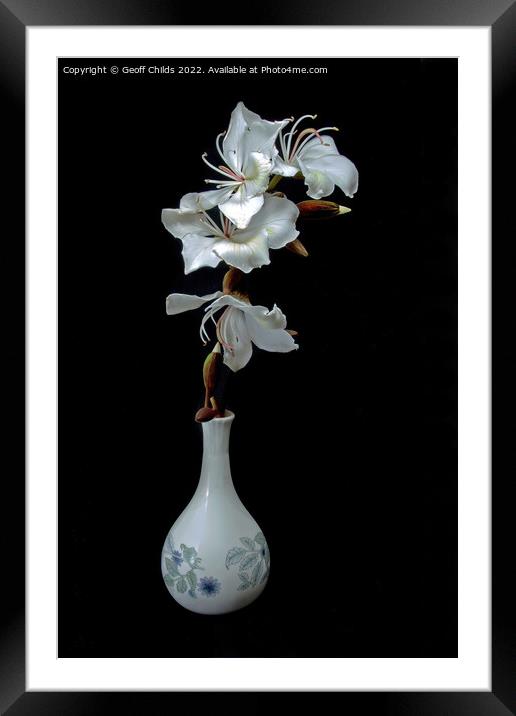 Top view of purple orchid flower in glass vase isolated on gray