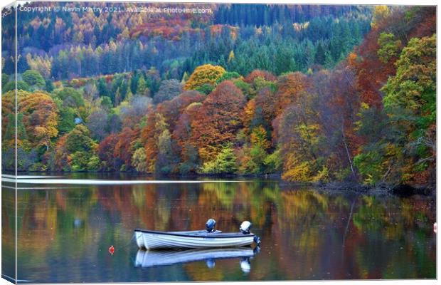  A small boat in Loch Faskally in Autumn  Canvas Print by Navin Mistry