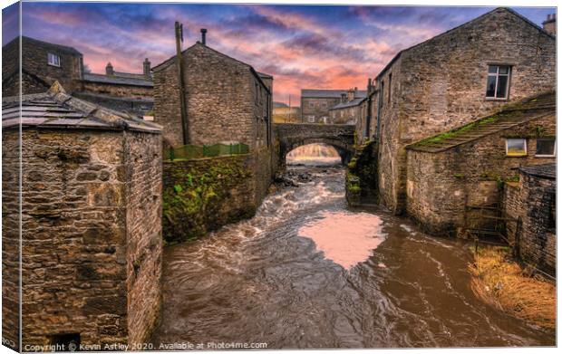 Yorkshire, Hawes 'Rapidly Running Through The Vill Canvas Print by Kevin Astley
