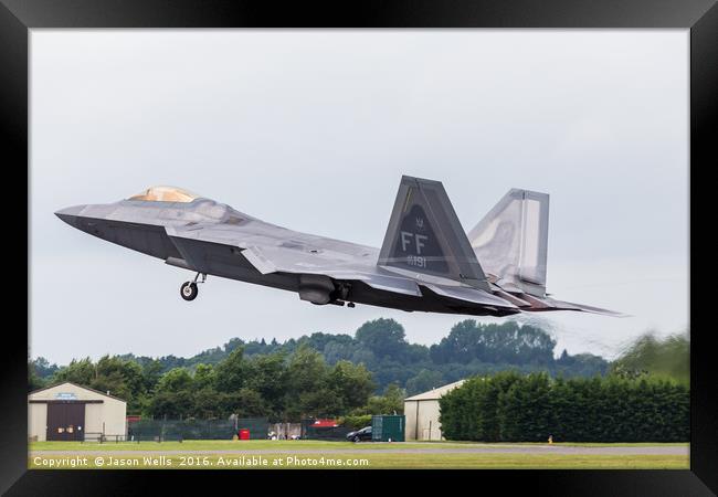 F-22A Raptor lifts it's landing gear as it exits t Framed Print by Jason Wells