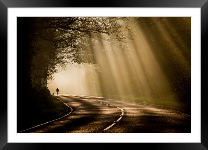 Cycling through sunrays Framed Mounted Print by Jonathan Smith