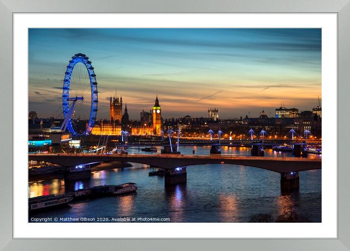 Beautiful landscape image of the London skyline at night looking along the River Thames Framed Mounted Print by Matthew Gibson