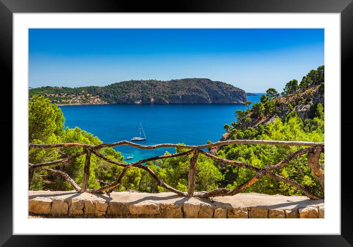 Idyllic bay with sailboat at blue sea Framed Mounted Print by Alex Winter