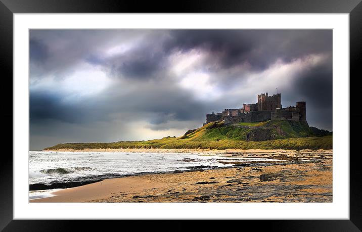Stormy sky over Bamburgh Castle Framed Mounted Print by Kevin Tate