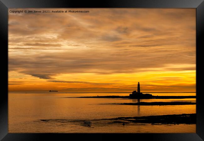 Silhouetted St Mary's Island at dawn Framed Print by Jim Jones