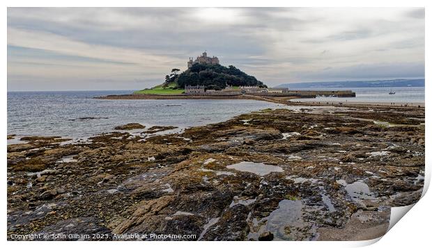 St Michaels Mount Marazion Cornwall England UK seen from a rocky outcrop on the mainland beach Print by John Gilham